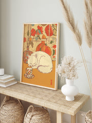 Illustrative Cat Wall Art of a white cat sleeping next to a floral teacup and vases with red flowers. - Image 3