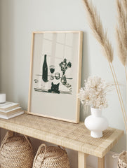 Minimalist black cat wall art illustration with a wine bottle, two glasses, and a small vase of flowers on a table. - Image 3