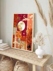 Mixed media collage wall art with a full moon, crescent, stars, and botanical elements in red, in an alternate framed mockup