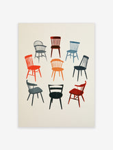 Illustrative wall art print featuring nine different retro-style chairs in various colours on a plain background