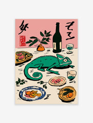 Green chameleon on a table with Japanese calligraphy, bottle, plant, and plates of food on a pink background