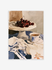 Watercolour still life print of cherries on a cake stand and a teacup on a blue tablecloth