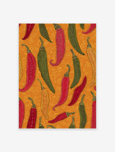 Colorful chili pepper wall art print featuring red, green, and yellow peppers with folk art patterns on an orange background.