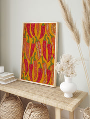 Vibrant illustrated chili pepper pattern wall art print featuring red, orange, and green peppers on a mustard yellow background. - Image 3