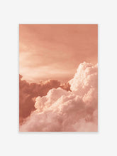 Voluminous white and pink clouds against a peach-toned sky, creating an abstract cloudscape wall art print
