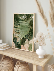 Coastal fishing boats on sand surrounded by large tropical palm leaves in a green, in an alternate framed mockup