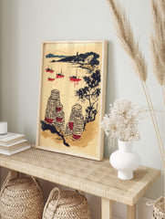 Illustrative coastal scene with red fishing boats, dark hills, and patterned lobster pots in, in an alternate framed mockup
