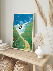 Illustrated coastal landscape wall art with a boat on blue waves, green wildflower cliffs, and a person cycling on a dirt path. - Image 3