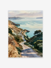 Watercolor-style print of a winding road descending through grassy hills towards a calm coastal bay