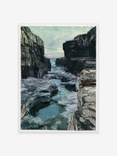 Rugged coastal rock inlet with stratified cliffs and blue sea water, nature landscape art print
