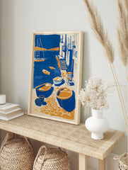 Coastal village poster showing blue and orange boats in a harbor with buildings, steps, and a sailboat. - Image 4