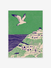 Illustrative coastal wall art print showing a white village on green hills, blue sea, and a flying seagull.