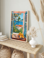 Coastal window art print showing a Mediterranean landscape with blue sea, orange trees, houses, and a plate of oranges. - Image 4