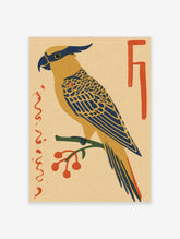 Vintage-style cockatoo art print with blue and yellow plumage on a branch with red berries