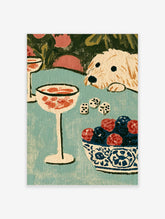 Cocktail glass, dice, and berry bowl with cream dog on teal table, still life art print