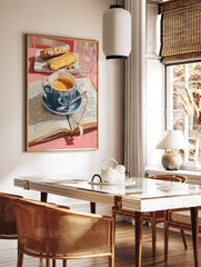 Coffee poster showing a blue cup of coffee, open book, and two pieces of cake on a pink table with water glasses. - Image 2