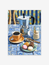 Coffee Wall Art featuring a Moka pot, orange coffee cup, macarons, and chocolate cake on a blue and white tiled table.