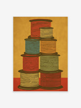 Colorful spool wall art print depicting a stack of thread spools in red, blue, orange, yellow, and green on a textured yellow background.