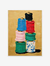 Colorful thread spools art painting stacked on a gold background, featuring blue, red, pink, green, and patterned white spools.
