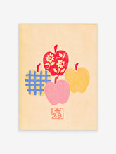 Colourful apple wall art print with red, yellow, pink, and blue grid-patterned fruit on cream background