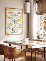 Colourful illustrative wall art print of yellow ducks with orange beaks walking through green grass, in a styled room mockup