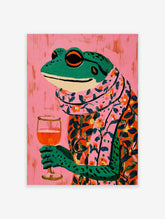 Illustrative colourful frog in floral shirt and scarf holding a wine glass on pink background
