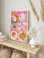 Colourful illustrative print of Mexican conchas, floral teapot, teacup, croissants, and, in an alternate framed mockup