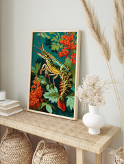 Colourful illustrative shrimp with red antennae and tail, amidst green leaves and orange, in an alternate framed mockup