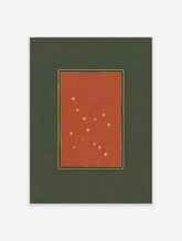 Vintage constellation art print featuring golden stars on a deep red background with black and gold borders, set on a green mat.