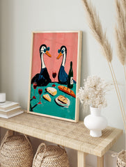 Illustrative art print of two geese in blue sunglasses having a picnic with wine, cheese, and, in an alternate framed mockup