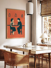 Illustrative wall art print of a couple at a bar with martini glasses, in an orange, black, and, in a styled room mockup