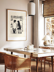 Monochrome illustration of a couple at a bar with bottles, glasses, and Japanese text on a cream, in a styled room mockup