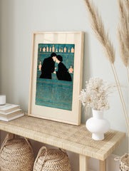 Illustrative teal and black wall art of a couple kissing at a bar with bottles on shelves, in an alternate framed mockup
