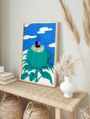 Illustrative art print of a couple on a giant green flower looking at a blue sky with white, in an alternate framed mockup