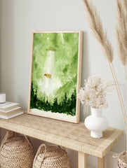 Watercolour illustration of a cow being abducted by a UFO in a green forest setting, in an alternate framed mockup