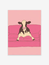 Illustrative art print of a black and white cow sitting on a pink couch against a pink background.