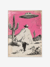Illustrated Cowboy UFO art print featuring a cowboy in a pink desert with cacti and a flying saucer overhead.