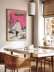 Illustrated Cowboy UFO art print featuring a cowboy in a pink desert with cacti and a flying saucer overhead. - Image 3