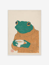 Cozy frog art print illustration wearing an orange sweater and holding a white coffee mug on a cream background.