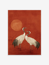 Japanese style crane wall art print featuring two white cranes with red crowns standing in red water under a red sun.