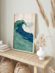 Illustrative ocean wave art print, large crashing wave in deep blue and green with white foam, in an alternate framed mockup