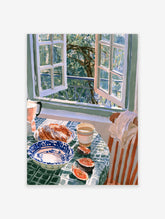 Watercolor illustration of croissants, coffee, and figs on a table by an open window overlooking green trees