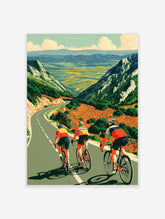 Cycling poster of three road cyclists descending a winding mountain road with green valleys and orange fields