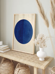 Minimalist dark blue circle geometric wall art print on an off-white background with subtle, in an alternate framed mockup