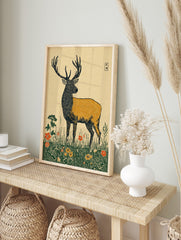 Illustrative stag deer wall art print in a meadow with red and yellow flowers and, in an alternate framed mockup