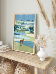 Illustrative landscape wall art featuring a brown deer standing in green and blue patterned fields under a clear blue sky. - Image 3