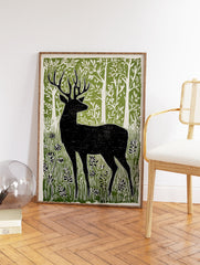 Black deer silhouette linocut print in a green forest with white trees and foliage, on a light background. - Image 2