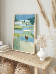 Deer wall art illustration of a brown deer in a green and blue patchwork landscape with trees and tall grass. - Image 3