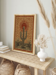Poster of a rustic desert landscape with a large saguaro cactus, smaller trees, and a smiling sun with rays in a reddish-brown and tan illustration style. - Image 4