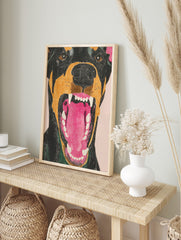 Close-up illustrative Doberman dog snarl wall art with open mouth, white fangs, and pink, in an alternate framed mockup